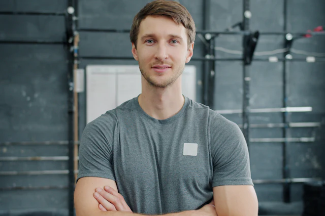 Personal trainer smiling in a gym