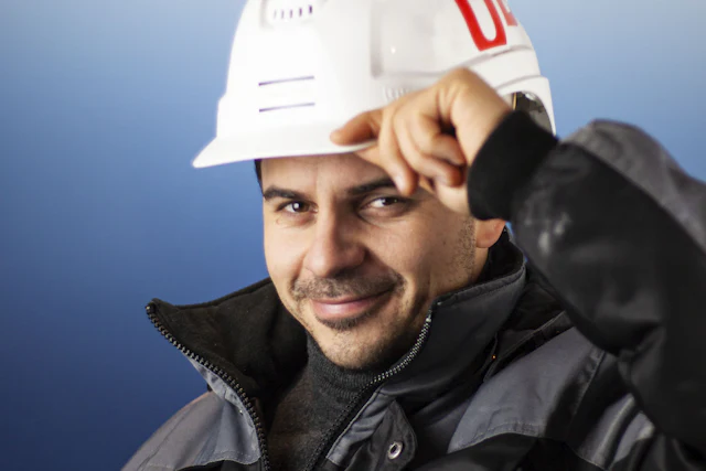 Engineer in a hard hat smiling