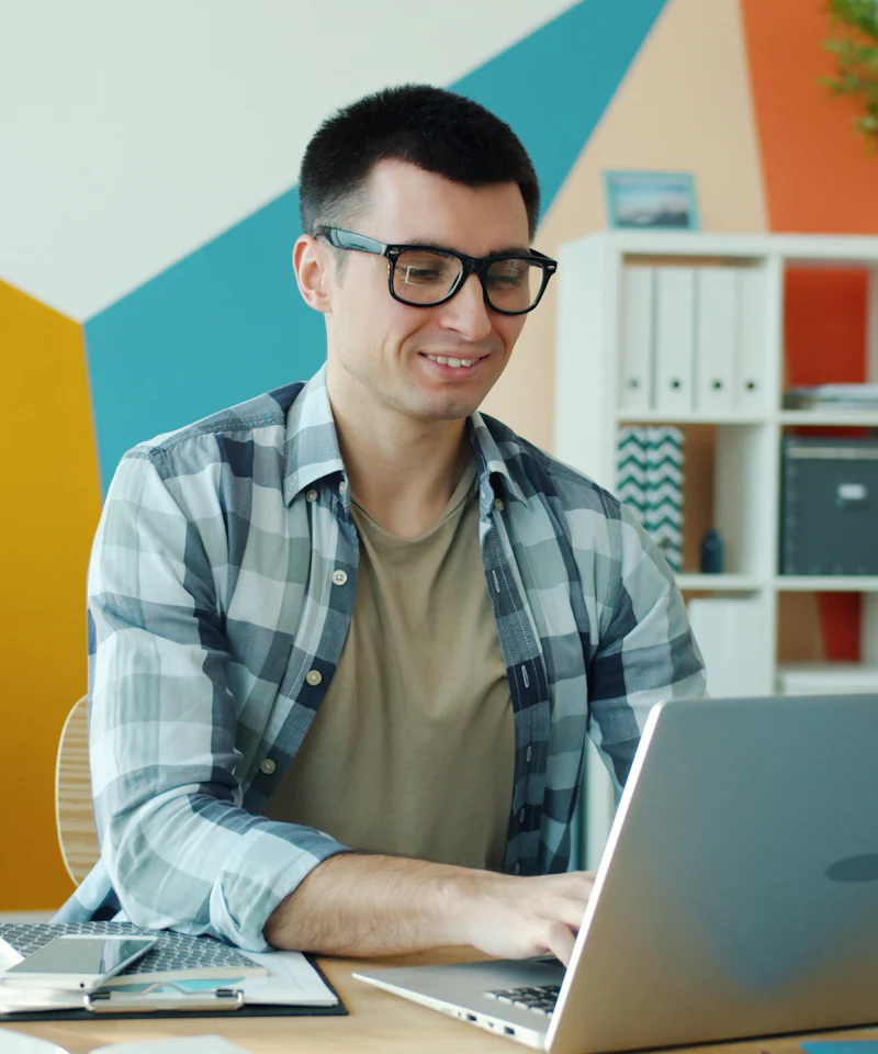 Web designer planning a website at his laptop
